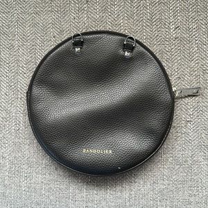 Bandolier Leather Circle attachment for crossbody phone case.